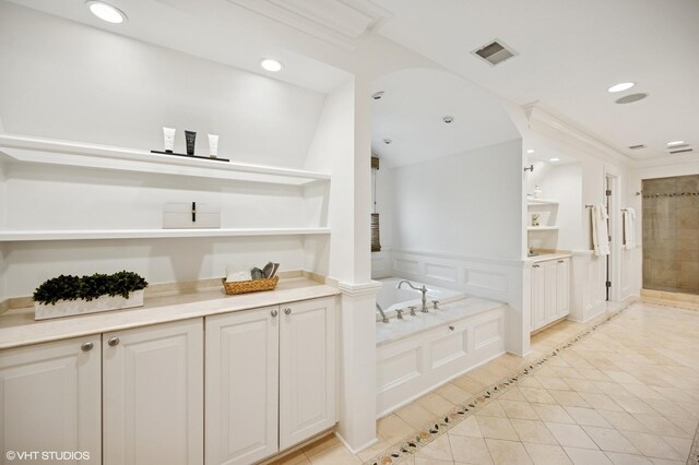 677 Greenleaf Ave, Glencoe, IL 60022 - bathroom featuring a bath, recessed lighting, tile patterned floors, a tile shower, and a decorative wall