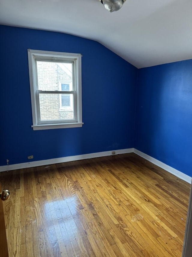 10035 S Yates Blvd, Chicago, IL 60617 - additional living space featuring lofted ceiling, hardwood / wood-style floors, and baseboards