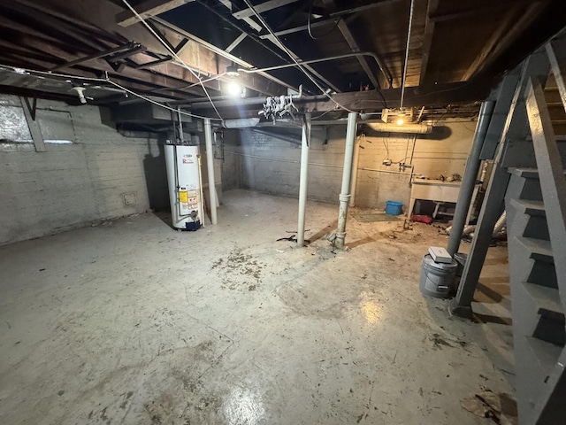 10035 S Yates Blvd, Chicago, IL 60617 - unfinished below grade area featuring gas water heater and a sink