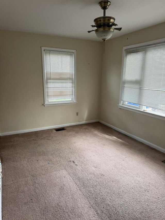 10035 S Yates Blvd, Chicago, IL 60617 - spare room with carpet, a ceiling fan, and baseboards
