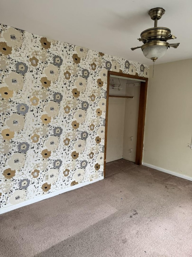 10035 S Yates Blvd, Chicago, IL 60617 - unfurnished room featuring light carpet, ceiling fan, baseboards, and wallpapered walls