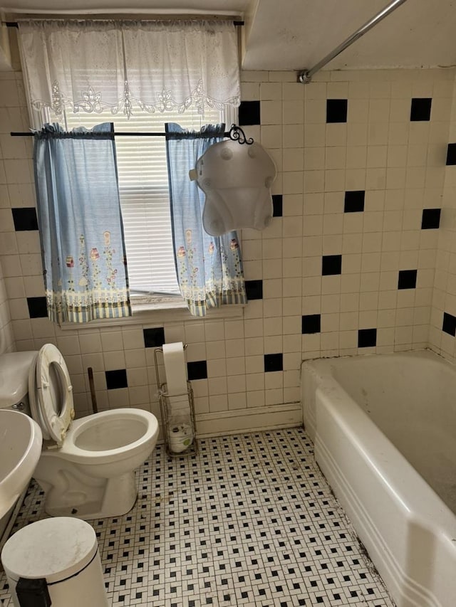 10035 S Yates Blvd, Chicago, IL 60617 - bathroom featuring toilet, a tub, tile patterned flooring, a shower, and tile walls