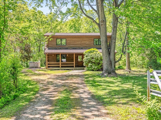 5123 Walnut Gove, Poplar Grove, IL 61065 - view of front of home featuring dirt driveway, covered porch, and log siding