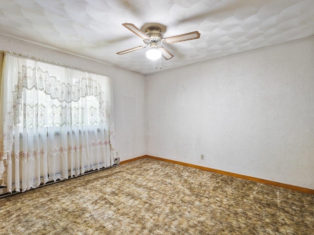 5123 Walnut Gove, Poplar Grove, IL 61065 - carpeted empty room with a ceiling fan, baseboards, a baseboard heating unit, and a textured wall