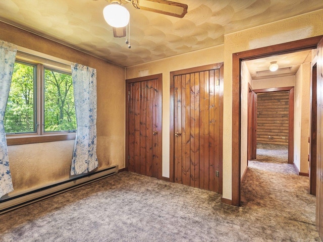 5123 Walnut Gove, Poplar Grove, IL 61065 - unfurnished bedroom featuring baseboard heating, carpet floors, multiple closets, and ceiling fan