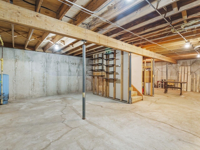 5123 Walnut Gove, Poplar Grove, IL 61065 - unfinished below grade area featuring a water pressure tank and stairs