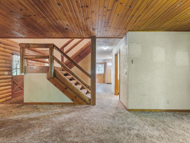 5123 Walnut Gove, Poplar Grove, IL 61065 - stairway featuring rustic walls, carpet floors, wooden ceiling, a textured wall, and baseboards