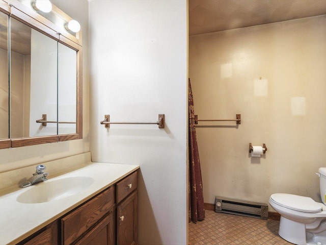 5123 Walnut Gove, Poplar Grove, IL 61065 - bathroom featuring a baseboard heating unit, toilet, and vanity
