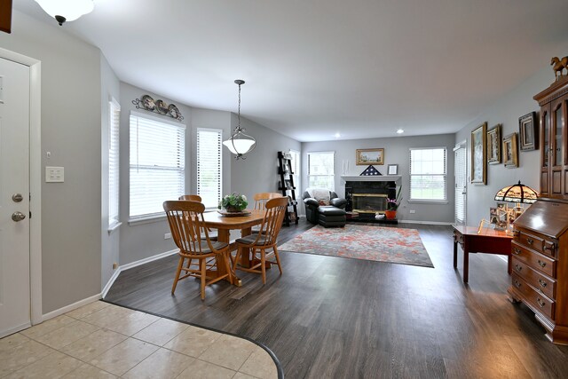 2136 Camden Ln Unit 2136, Hanover Park, IL 60133 - tiled dining room with baseboards, a glass covered fireplace, and recessed lighting