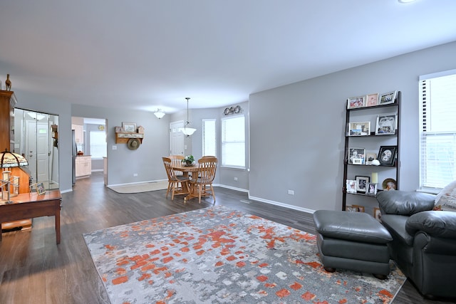 2136 Camden Ln Unit 2136, Hanover Park, IL 60133 - living room featuring dark wood-style flooring and baseboards