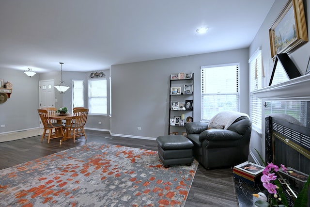 2136 Camden Ln Unit 2136, Hanover Park, IL 60133 - living room featuring dark wood-style floors, baseboards, a tiled fireplace, and recessed lighting