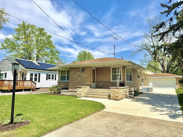 1128 Somonauk St, Sycamore, IL 60178 - view of front of property with a front yard, an outdoor structure, stone siding, and a deck