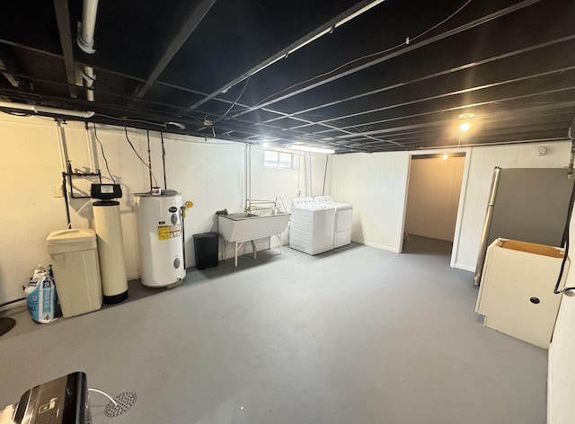 1128 Somonauk St, Sycamore, IL 60178 - basement featuring water heater, washer and dryer, a sink, and a water softener system