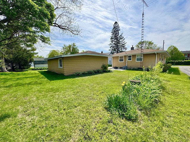 1128 Somonauk St, Sycamore, IL 60178 - rear view of property featuring a yard and a chimney