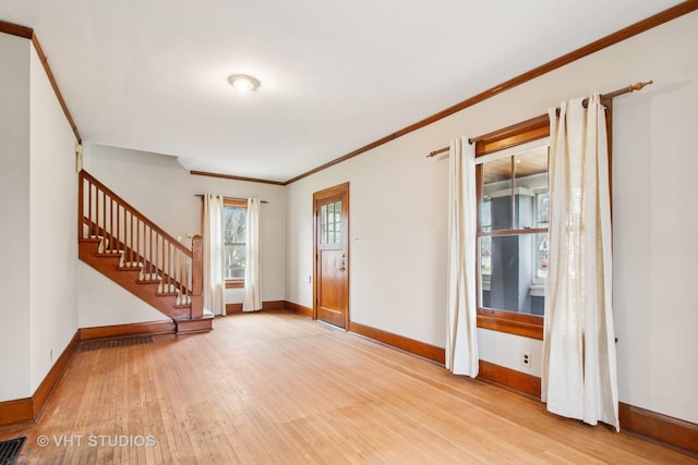 443 Harrison St, West Chicago, IL 60185 - foyer entrance with light wood-style flooring, baseboards, stairs, and crown molding
