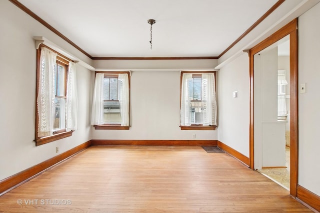 443 Harrison St, West Chicago, IL 60185 - spare room with light wood-style floors, crown molding, and baseboards
