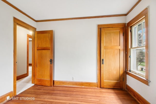 443 Harrison St, West Chicago, IL 60185 - unfurnished room with crown molding, baseboards, and light wood-style floors