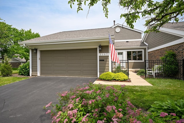 2107 Timber Ln, Wheaton, IL 60189 - view of front facade with driveway, an attached garage, and roof with shingles