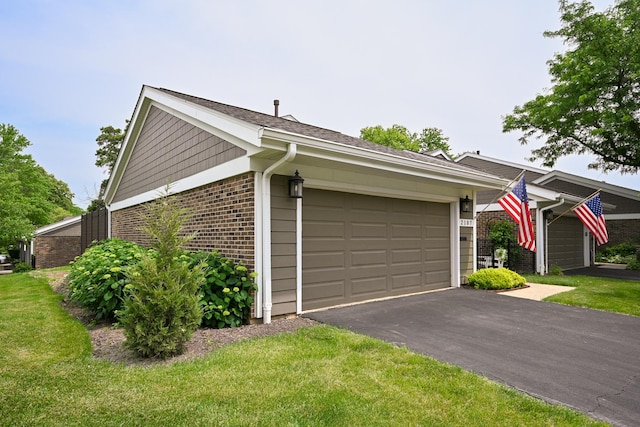 2107 Timber Ln, Wheaton, IL 60189 - view of side of home with brick siding, a garage, a yard, and driveway