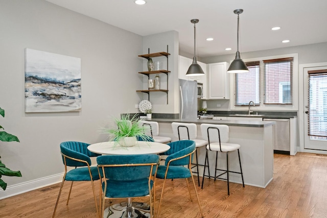 2803 N Wolcott Ave Unit D, Chicago, IL 60657 - dining area featuring recessed lighting, light wood-type flooring, and baseboards