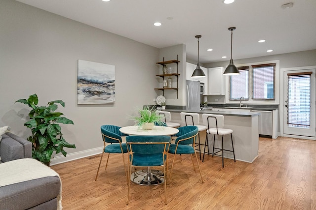 2803 N Wolcott Ave Unit D, Chicago, IL 60657 - dining room with recessed lighting, light wood finished floors, and baseboards