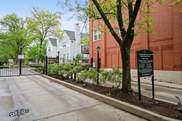 2803 N Wolcott Ave Unit D, Chicago, IL 60657 - view of side of property with a gate, brick siding, and a residential view