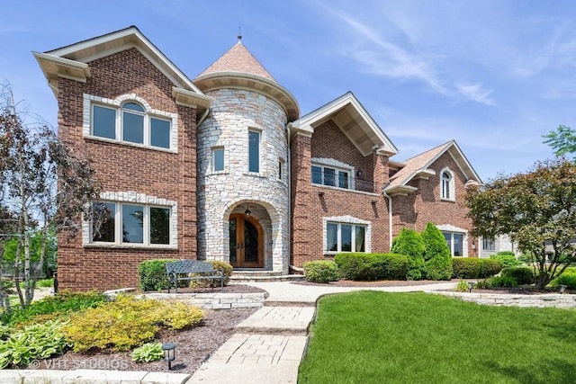 10944 Arbor Ridge Dr, Orland Park, IL 60467 - view of front of home with brick siding, a front lawn, and stone siding