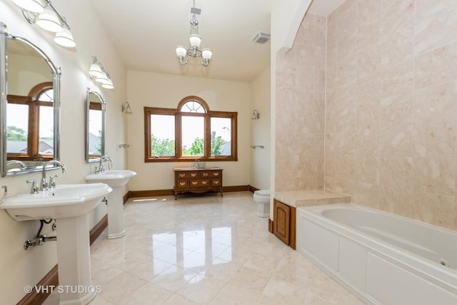 10944 Arbor Ridge Dr, Orland Park, IL 60467 - bathroom with a bathtub and a chandelier
