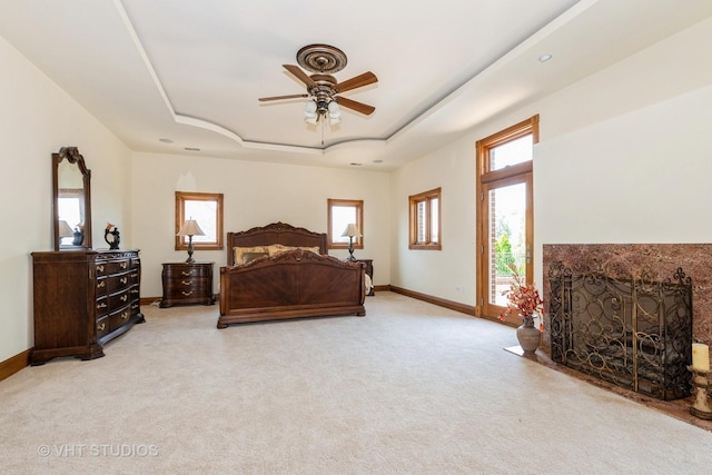 10944 Arbor Ridge Dr, Orland Park, IL 60467 - bedroom with a raised ceiling, a high end fireplace, and light carpet