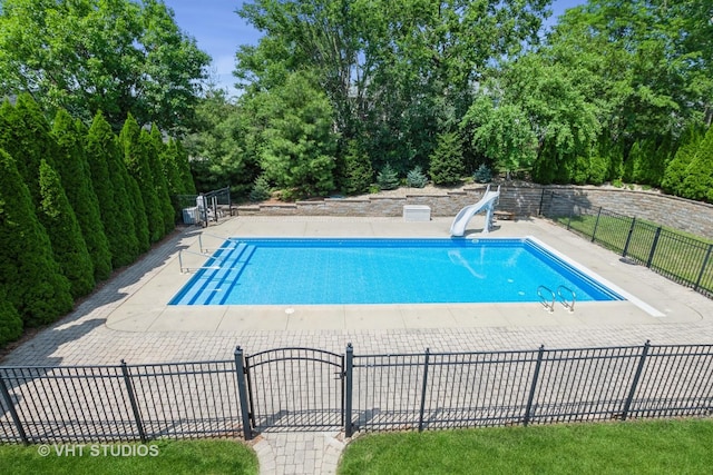 10944 Arbor Ridge Dr, Orland Park, IL 60467 - view of swimming pool featuring a water slide and view of wooded area