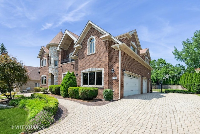 10944 Arbor Ridge Dr, Orland Park, IL 60467 - view of front of house with a garage, brick siding, and driveway