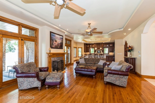 10944 Arbor Ridge Dr, Orland Park, IL 60467 - living room featuring a ceiling fan, hardwood / wood-style floors, a tray ceiling, plenty of natural light, and recessed lighting