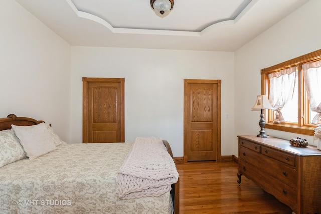 10944 Arbor Ridge Dr, Orland Park, IL 60467 - bedroom featuring light wood-style floors and a raised ceiling