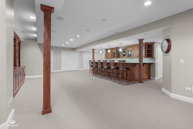 491 Bloomfield Cir W, Oswego, IL 60543 - indoor wet bar with light colored carpet, baseboards, ornate columns, recessed lighting, and pendant lighting