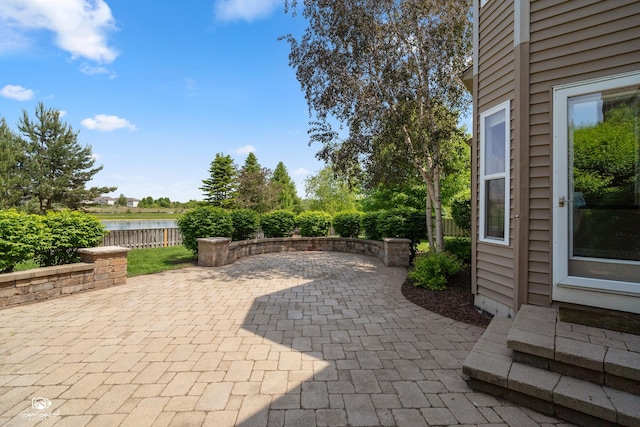 491 Bloomfield Cir W, Oswego, IL 60543 - view of patio featuring a water view