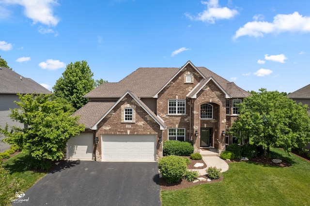 491 Bloomfield Cir W, Oswego, IL 60543 - traditional-style home featuring driveway, brick siding, a front yard, and a shingled roof