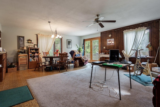 4539 Matthew Ave, Roscoe, IL 61073 - living area featuring ceiling fan, wooden walls, a chandelier, and an office area
