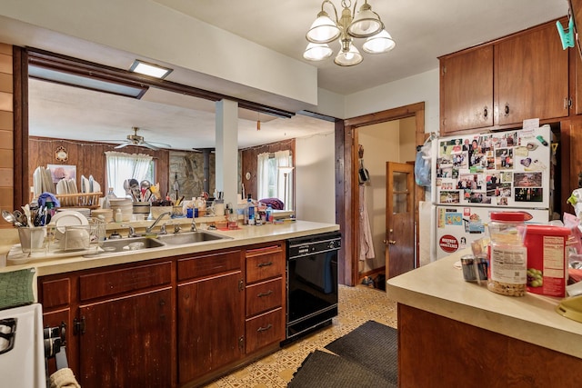 4539 Matthew Ave, Roscoe, IL 61073 - kitchen featuring dishwasher, freestanding refrigerator, light countertops, a sink, and a chandelier
