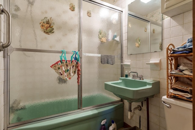 4539 Matthew Ave, Roscoe, IL 61073 - bathroom with tile walls, toilet, enclosed tub / shower combo, and a sink