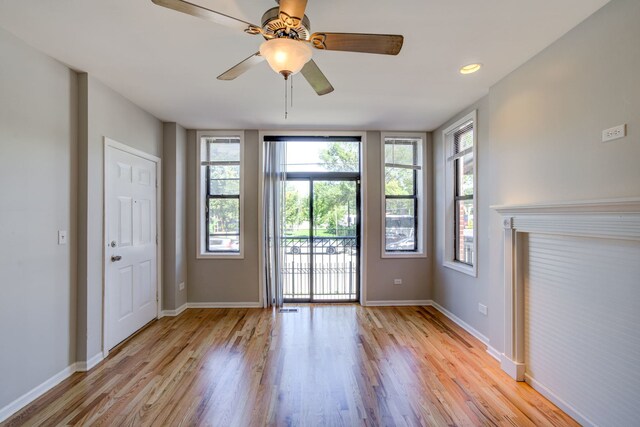 947 W 51st St, Chicago, IL 60609 - doorway featuring plenty of natural light, light wood-style floors, and baseboards