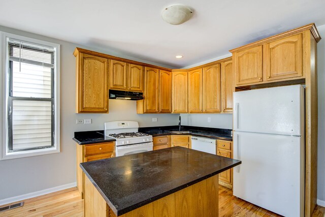 947 W 51st St, Chicago, IL 60609 - kitchen with white appliances, under cabinet range hood, light wood-type flooring, a sink, and recessed lighting