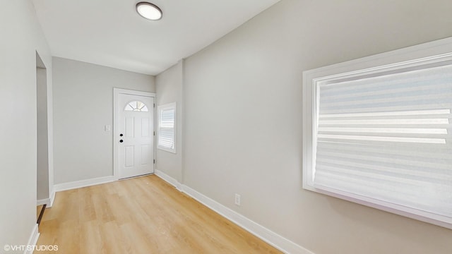 7545 S Perry Ave, Chicago, IL 60620 - foyer entrance featuring light wood-style floors and baseboards