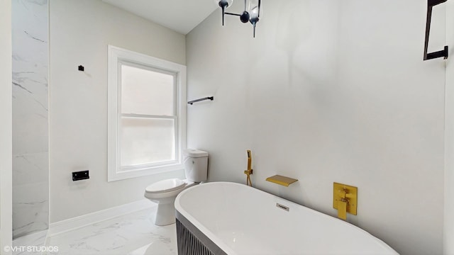 7545 S Perry Ave, Chicago, IL 60620 - full bathroom featuring marble look tile flooring, a soaking tub, toilet, and baseboards