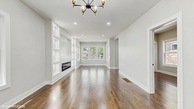 7545 S Perry Ave, Chicago, IL 60620 - unfurnished living room featuring a chandelier, dark wood finished floors, baseboards, and recessed lighting