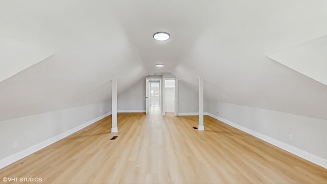 7545 S Perry Ave, Chicago, IL 60620 - additional living space featuring light wood-type flooring, lofted ceiling, and baseboards