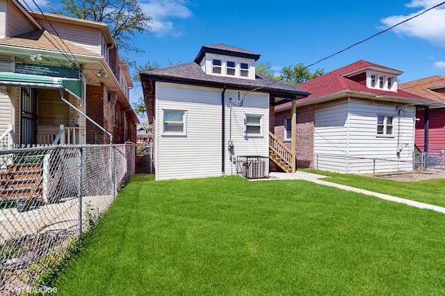 7545 S Perry Ave, Chicago, IL 60620 - back of property featuring central AC and a shingled roof
