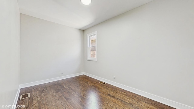7545 S Perry Ave, Chicago, IL 60620 - unfurnished room featuring dark wood-style flooring and baseboards
