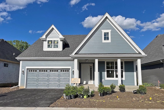 1568 Dempsey Dr, Saint Charles, IL 60174 - view of front of home with covered porch, asphalt driveway, roof with shingles, and a garage