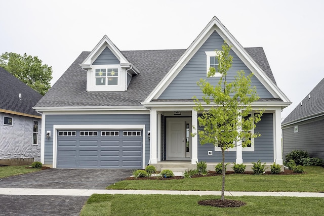 1568 Dempsey Dr, Saint Charles, IL 60174 - view of front facade with driveway, a shingled roof, and a garage