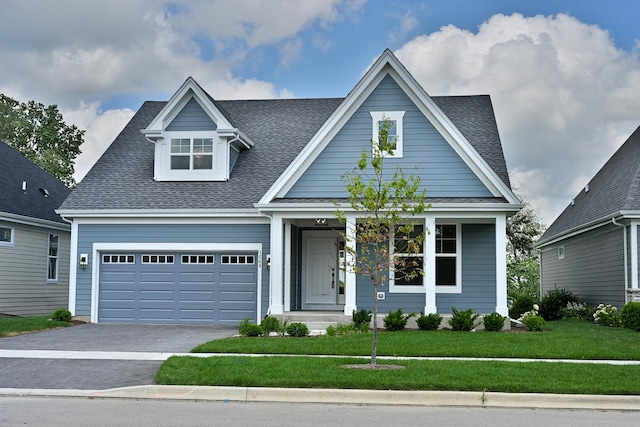 1568 Dempsey Dr, Saint Charles, IL 60174 - view of front facade with a front lawn, asphalt driveway, roof with shingles, and a garage